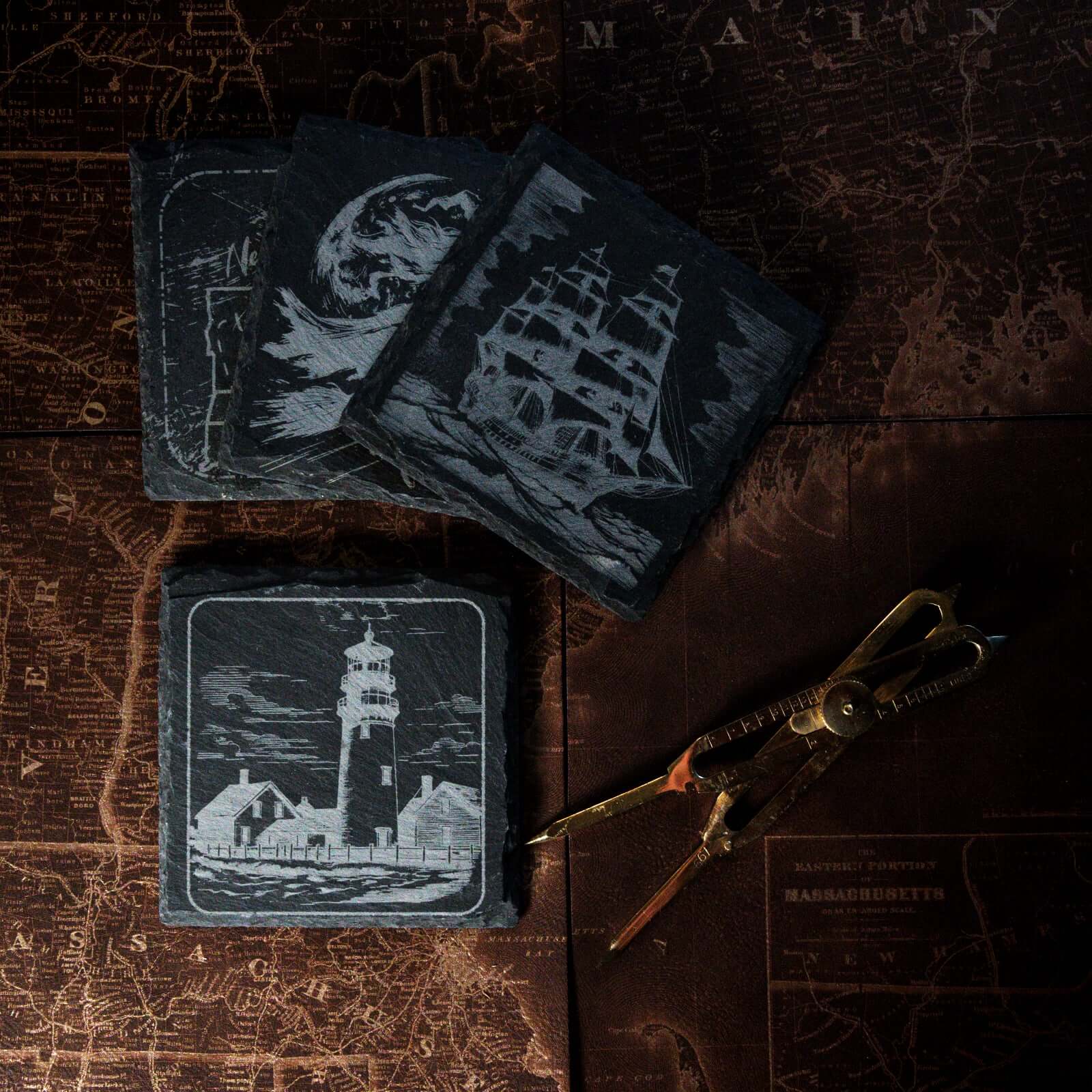 Image depicts a slate coaster with a lighthouse engraved on it.